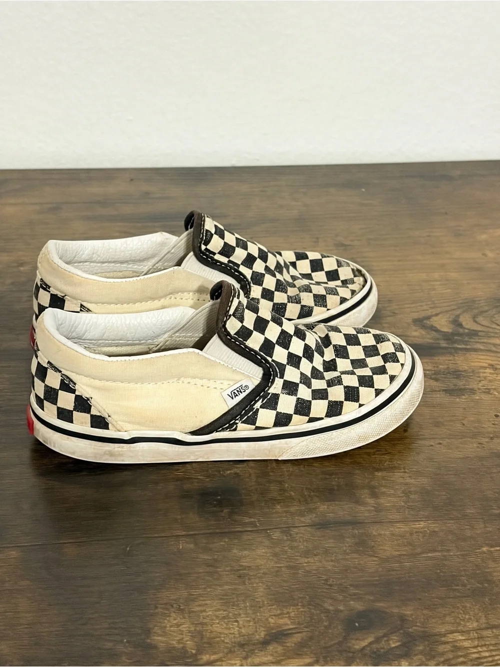 Vans Kids Slip-On Checkerboard Sneakers in Black and Cream